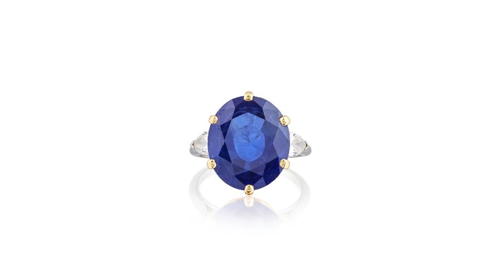A Cartier ring bearing an oval-cut, 11.50-carat Madagascar sapphire between two pear-cut diamonds at Bonhams image