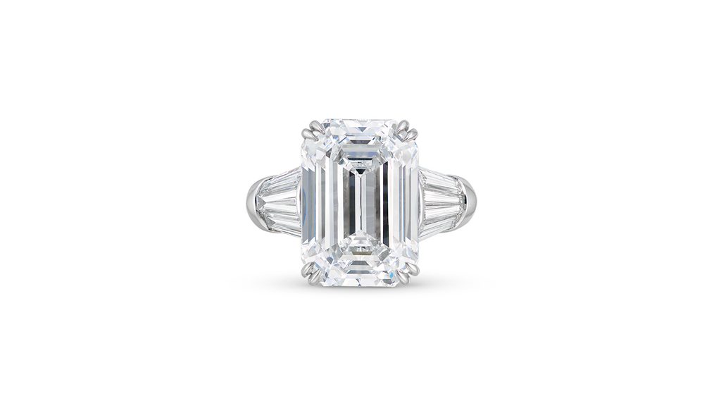 A Harry Winston ring bearing a cut cornered rectangular step-cut, 11.74-carat, D-color, internally flawless, type IIa diamond center stone with tapered baguette diamond at Christie's image