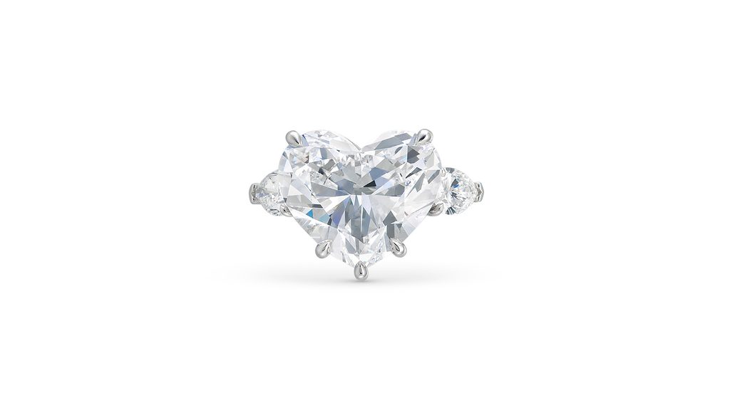 A ring with a heart-shaped brilliant-cut, 10.82-carat, D, internally flawless, type IIa diamond between pear-shaped diamonds at Christie's image
