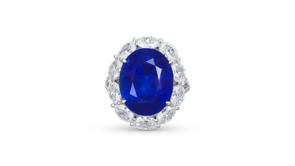 Centering an oval-cut, 21.87-carat, royal-blue Burmese sapphire, this ring has a surround of oval and round diamonds at Christie's image