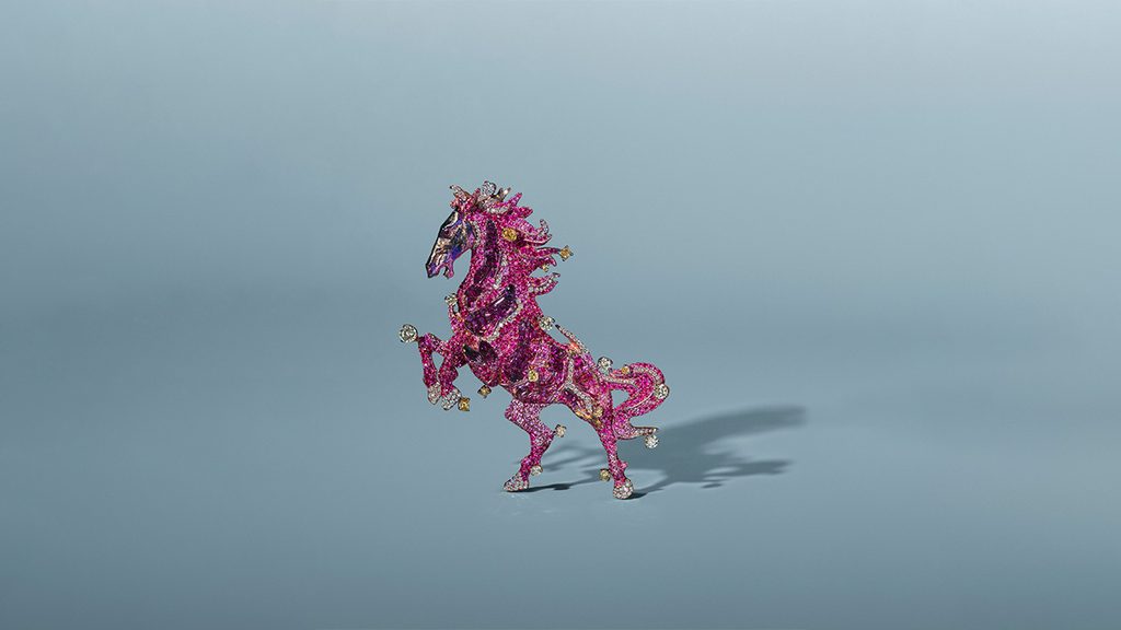Wallace Chan created this brooch in the shape of a rearing stallion. The piece is covered in variously shaped yellow and brown diamonds, round diamonds, pink sapphires and carved rock crystal at Christie's image