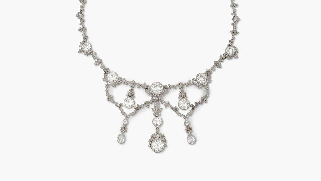 This necklace, which can also be worn as a hair accessory, contains two larger brilliant-cut diamonds at the front weighing around 4.10 and 4.20 carats. The remaining brilliant-cut diamonds at the front weigh between 2 and 2.90 carats, and the two pear-shaped stones are approximately 1.20 carats each at Sotheby's image