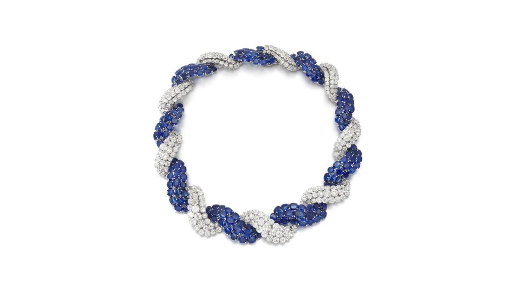 A sapphire and diamond necklace from 1965 is designed as intertwined ribbons and features around 35 carats of oval, violetish-blue sapphires and approximately 55 carats of brilliant-cut diamonds at Sotheby's image