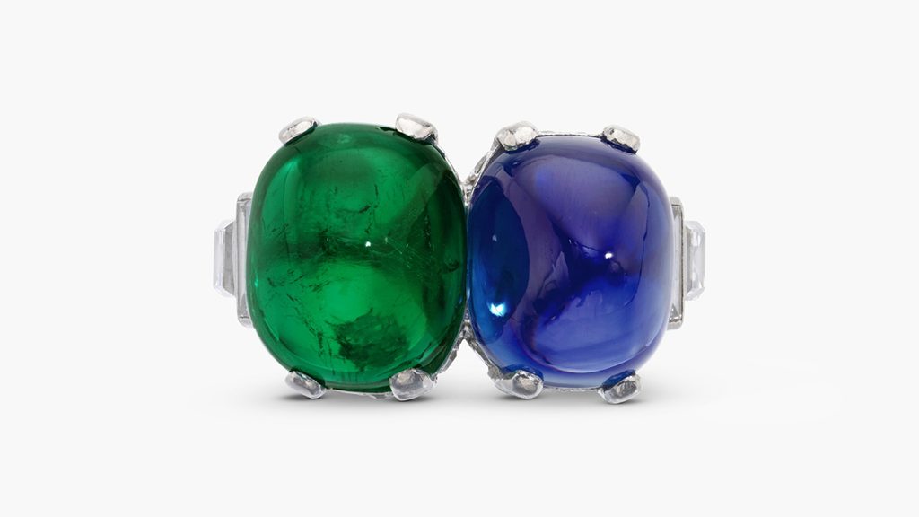 A toi et moi ring with a 7.83-carat Kashmir cabochon sapphire and a 6.77-carat Colombian cabochon emerald between baguette and square diamond shoulders. The jewel, created in the mid-20th century, was previously in the collection of Catherine, Lady Walston at Sotheby's image