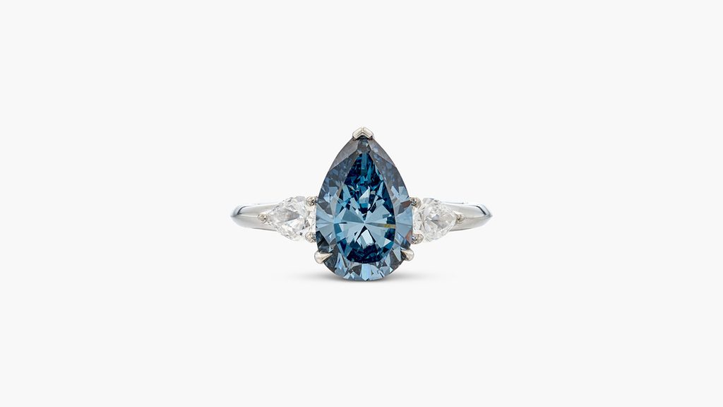 This Graff ring features a pear-shaped, 2.88-carat, fancy-deep-blue, VS2-clarity diamond between pear-shaped diamonds at Sotheby's image