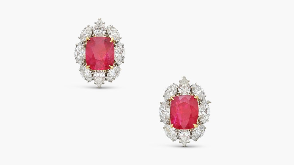 A pair of ear clips bearing cushion-shaped Burmese rubies weighing 6.18 and 6.11 carats surrounded by pear- and marquise-shaped diamonds at Sotheby's image