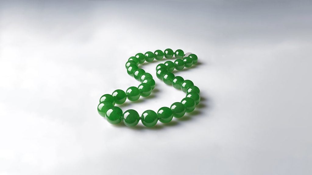A necklace with 33 jadeite beads and a diamond clasp at Christie's image