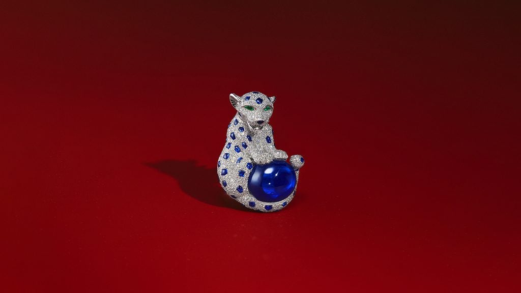 A Cartier Baby Panthère brooch containing sapphires and diamonds at Christie's image